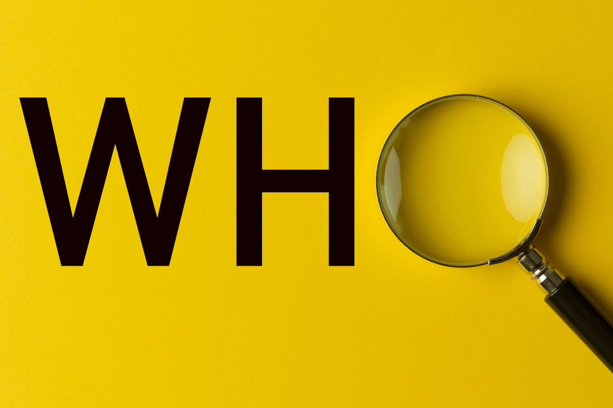 An image of the word WHO with a magnifying glass replacing the letter O on a yellow background.