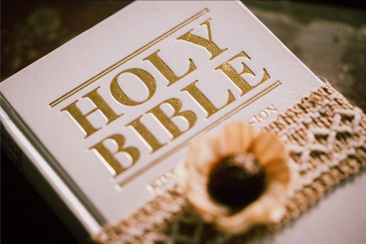 A closeup image of a white Holy Bible.